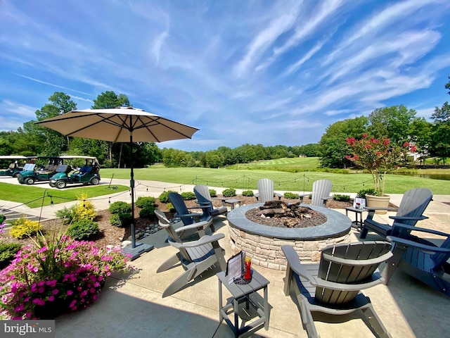 view of patio / terrace featuring an outdoor fire pit
