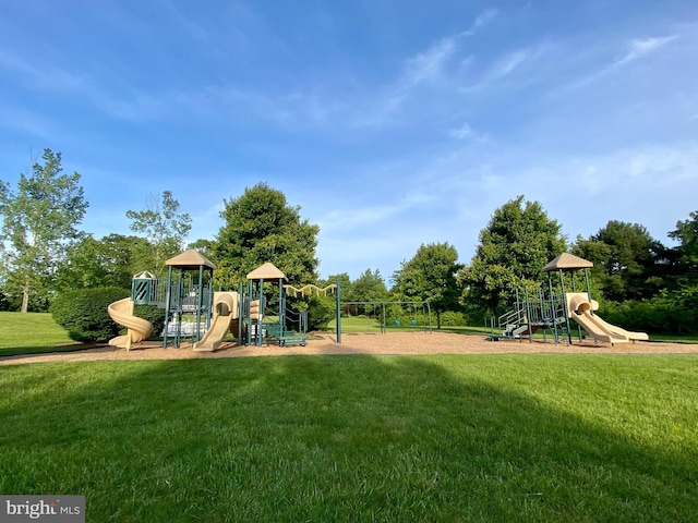 community playground featuring a lawn