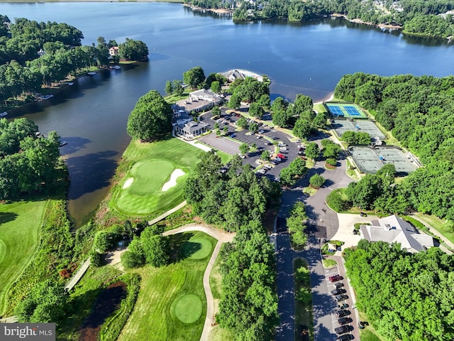drone / aerial view with a water view and golf course view