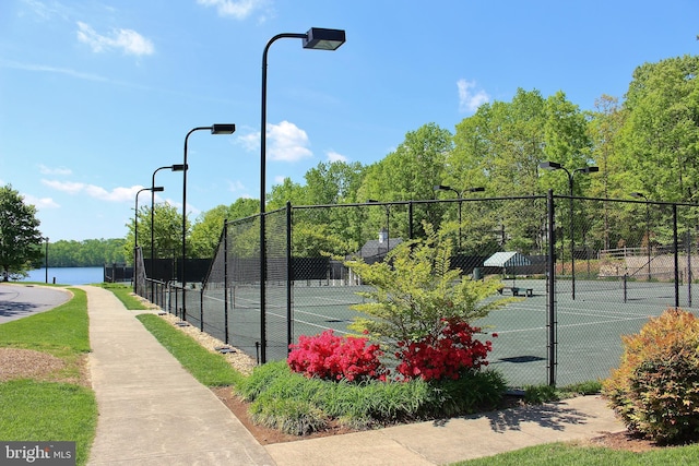 view of sport court featuring fence