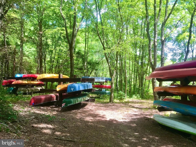 view of property's community featuring a forest view