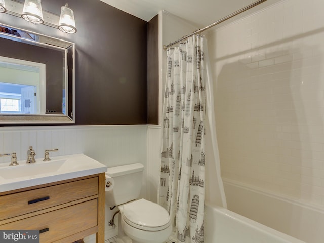 112 E Jefferson St E, Falls Church, VA 22046 - bathroom with a wainscoted wall, vanity, shower / tub combo, and toilet