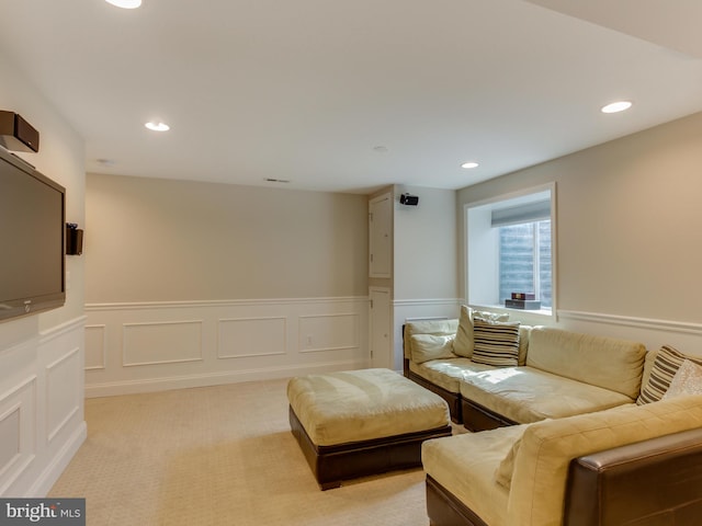 112 E Jefferson St E, Falls Church, VA 22046 - living area featuring a wainscoted wall, recessed lighting, light colored carpet, and a decorative wall