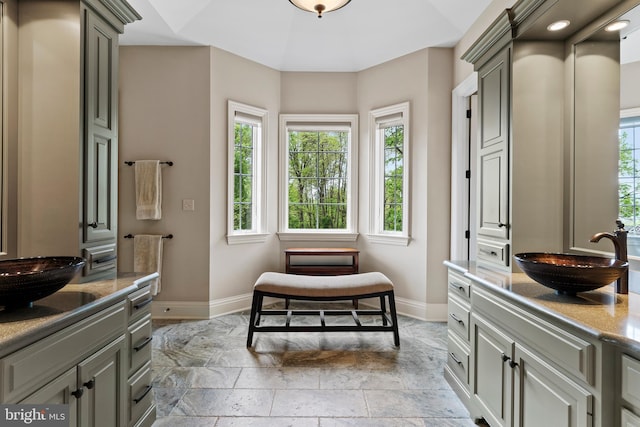 360 Fishing Creek Valley Rd, Harrisburg, PA 17112 - bathroom with baseboards, vanity, and stone finish flooring