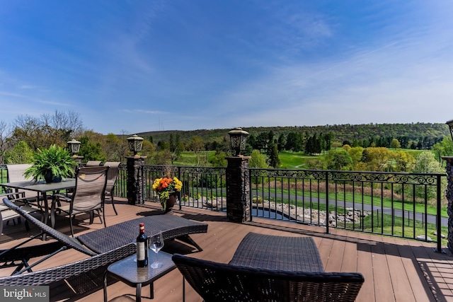 wooden deck with outdoor dining space