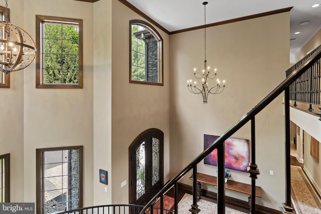 360 Fishing Creek Valley Rd, Harrisburg, PA 17112 - foyer featuring a chandelier, a high ceiling, stairs, arched walkways, and ornamental molding