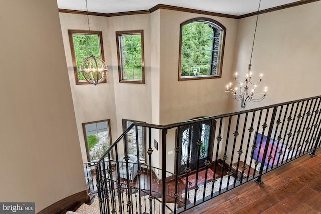 360 Fishing Creek Valley Rd, Harrisburg, PA 17112 - staircase featuring a chandelier, wood-type flooring, ornamental molding, and baseboards