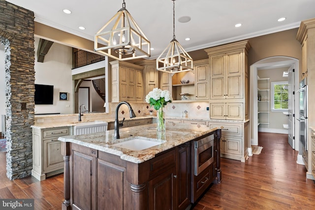 360 Fishing Creek Valley Rd, Harrisburg, PA 17112 - kitchen with a sink, arched walkways, dark wood finished floors, a kitchen island with sink, and ornamental molding