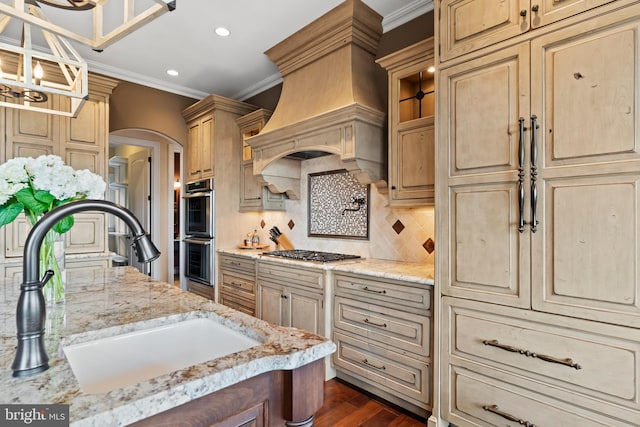 360 Fishing Creek Valley Rd, Harrisburg, PA 17112 - kitchen featuring a sink, stainless steel appliances, custom exhaust hood, crown molding, and arched walkways