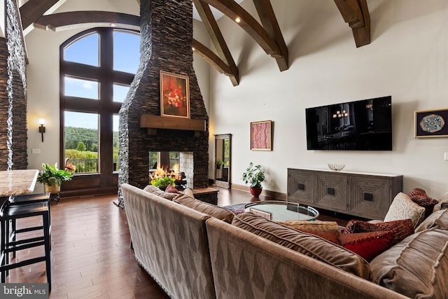 360 Fishing Creek Valley Rd, Harrisburg, PA 17112 - living room with high vaulted ceiling, beam ceiling, a stone fireplace, and hardwood / wood-style flooring