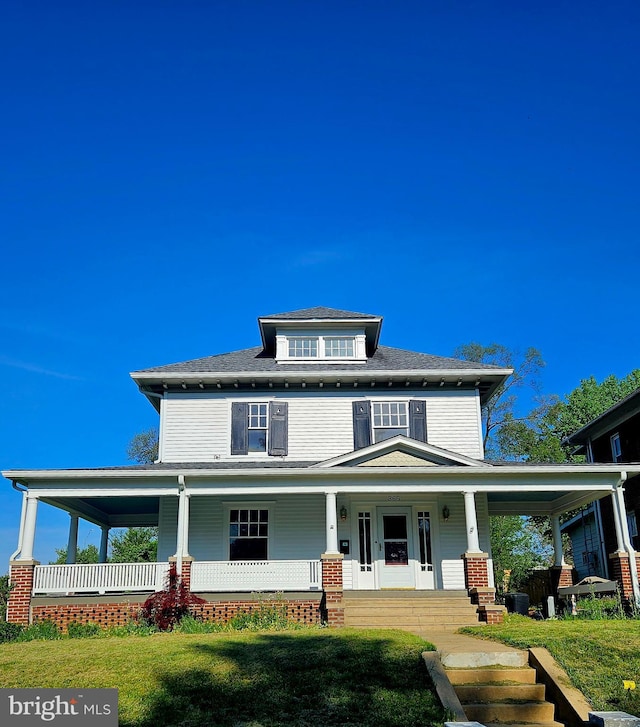 rear view of house with covered porch