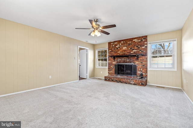 15700 Presswick Ln, Bowie, MD 20716 - unfurnished living room with visible vents, a ceiling fan, carpet, and a brick fireplace