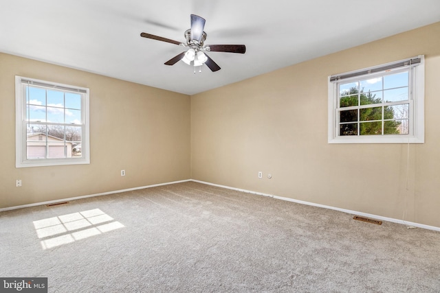 15700 Presswick Ln, Bowie, MD 20716 - carpeted empty room featuring baseboards, visible vents, a ceiling fan, and a wealth of natural light