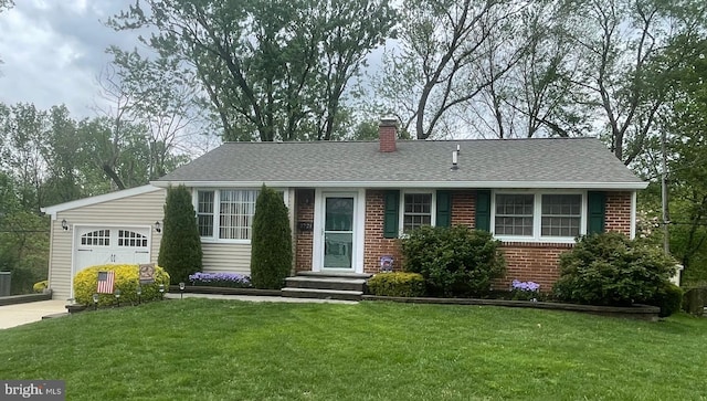 ranch-style home featuring a chimney, a front lawn, concrete driveway, and an attached garage