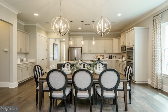 kitchen with stainless steel appliances, a kitchen island, a chandelier, and baseboards