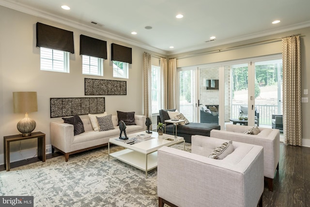 living area with ornamental molding, recessed lighting, visible vents, and wood finished floors