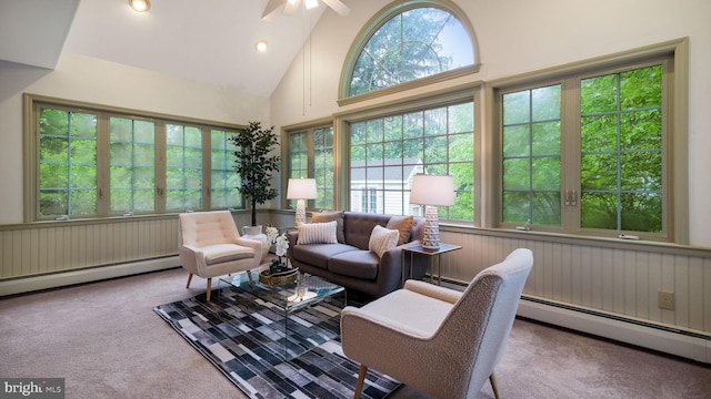 sunroom / solarium with baseboard heating and lofted ceiling