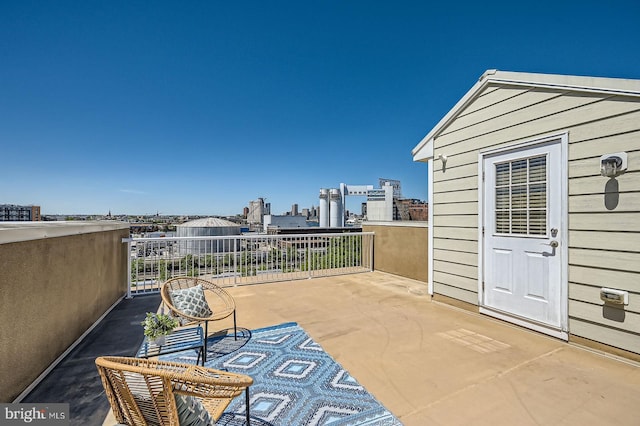 1308 Lowman St, Baltimore, MD 21230 - view of patio featuring a balcony and a city view