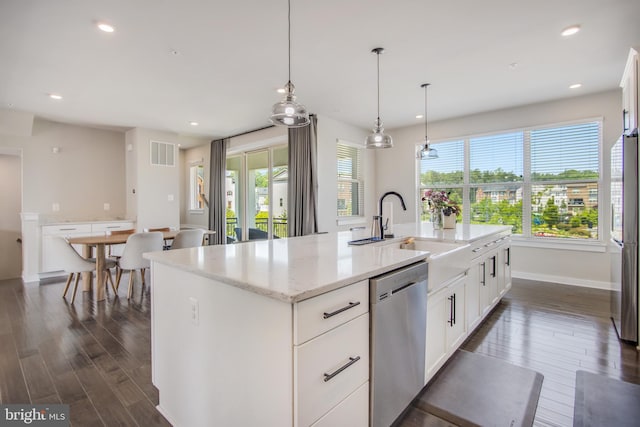 5510 Woodyard Rd, Upper Marlboro, MD 20772 - kitchen featuring stainless steel appliances, dark wood-type flooring, healthy amount of natural light, white cabinets, and recessed lighting