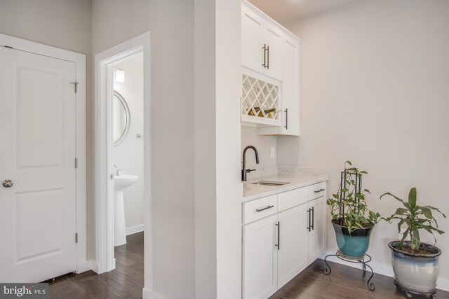 5510 Woodyard Rd, Upper Marlboro, MD 20772 - indoor wet bar featuring dark wood-style flooring and baseboards
