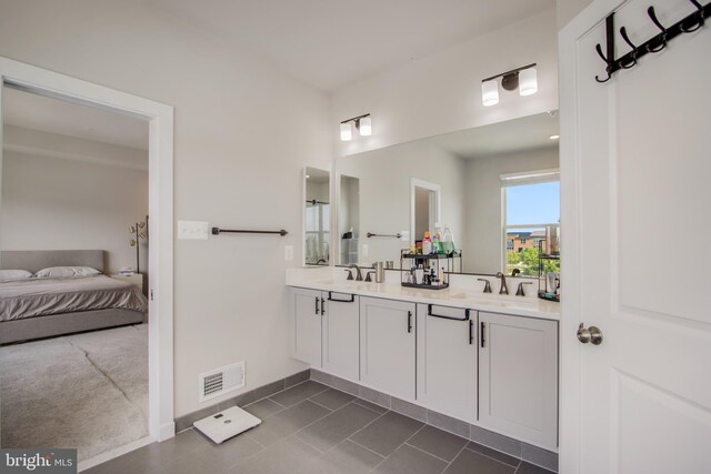 5510 Woodyard Rd, Upper Marlboro, MD 20772 - full bathroom with tile patterned floors, double vanity, baseboards, and ensuite bath