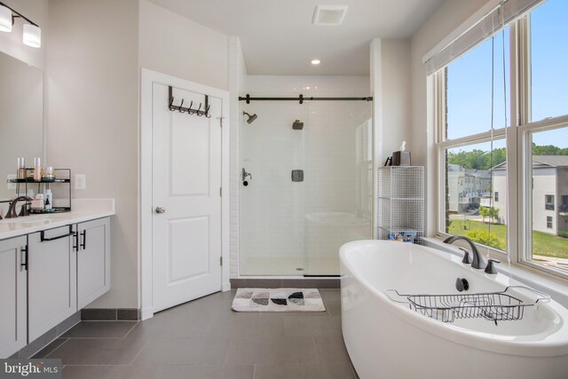 5510 Woodyard Rd, Upper Marlboro, MD 20772 - full bathroom with a shower stall, vanity, a soaking tub, tile patterned flooring, and recessed lighting