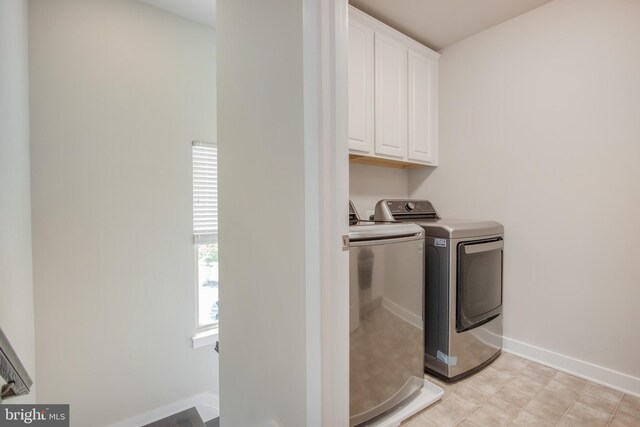 5510 Woodyard Rd, Upper Marlboro, MD 20772 - laundry room with cabinet space, washing machine and dryer, and baseboards