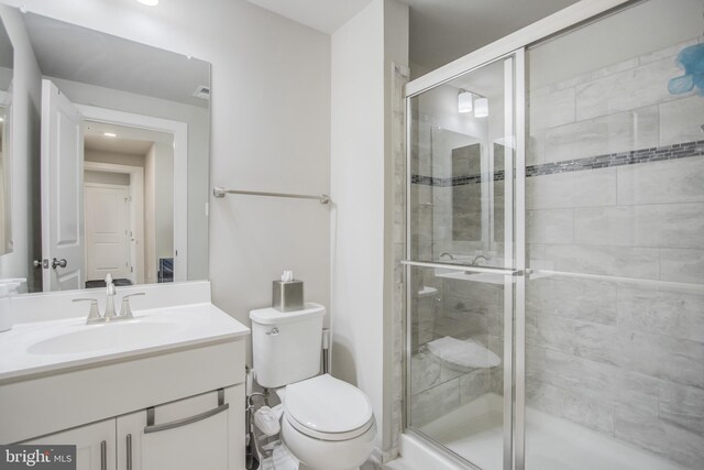 5510 Woodyard Rd, Upper Marlboro, MD 20772 - full bathroom with a stall shower, toilet, and vanity