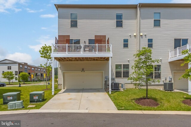 5510 Woodyard Rd, Upper Marlboro, MD 20772 - view of front of property featuring an attached garage, concrete driveway, central AC unit, and a front yard