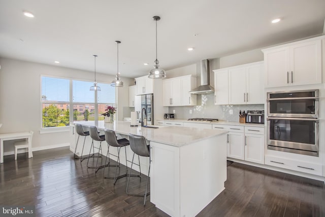 5510 Woodyard Rd, Upper Marlboro, MD 20772 - kitchen with wall chimney exhaust hood, appliances with stainless steel finishes, dark wood finished floors, a sink, and recessed lighting