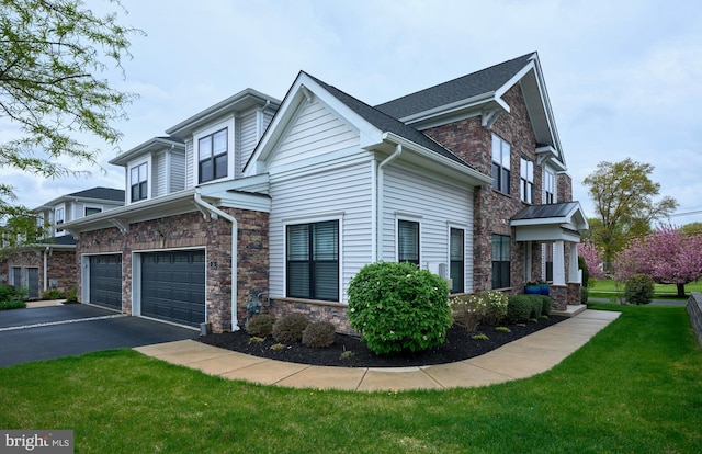 view of home's exterior featuring aphalt driveway, an attached garage, stone siding, and a lawn