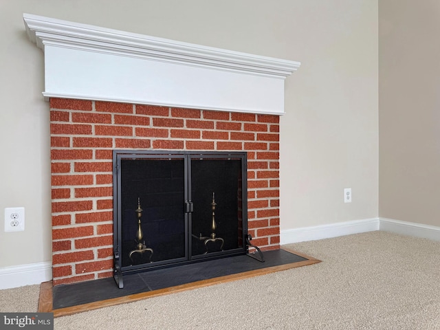 details featuring baseboards, carpet, and a fireplace