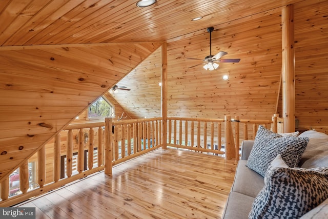 additional living space with a ceiling fan, wooden ceiling, wood-type flooring, and high vaulted ceiling