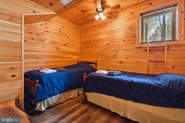 bedroom with wooden ceiling, wood finished floors, and wood walls