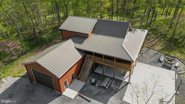 view of subject property with a forest