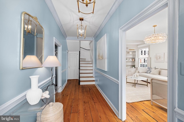 201 Duke St, Alexandria, VA 22314 - hall with wood-type flooring, ornamental molding, a chandelier, and stairway