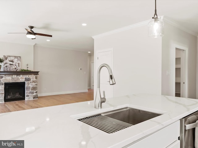 149 Matthew Dr, Chambersburg, PA 17201 - kitchen with crown molding, decorative light fixtures, a sink, and light wood-style floors
