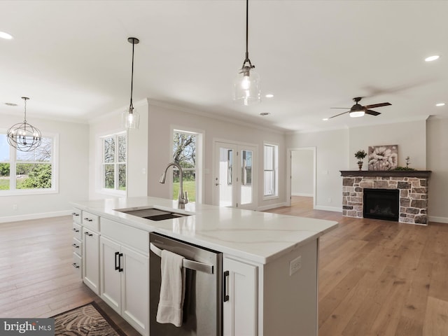 149 Matthew Dr, Chambersburg, PA 17201 - kitchen with stainless steel dishwasher, a sink, baseboards, and decorative light fixtures