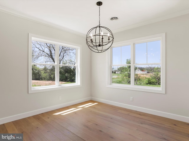 149 Matthew Dr, Chambersburg, PA 17201 - unfurnished dining area featuring an inviting chandelier, baseboards, light wood-style floors, and a healthy amount of sunlight