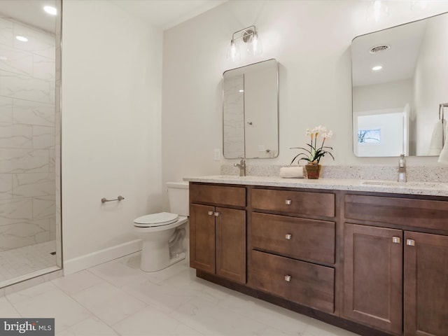 149 Matthew Dr, Chambersburg, PA 17201 - full bath with visible vents, a sink, toilet, marble finish floor, and tiled shower