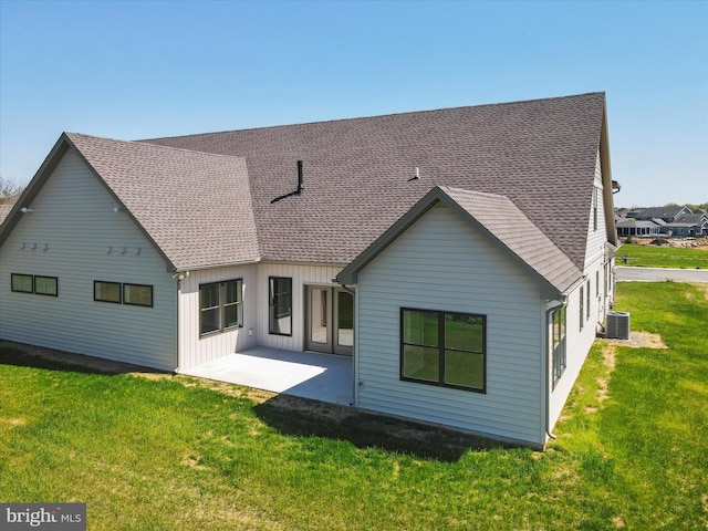 149 Matthew Dr, Chambersburg, PA 17201 - rear view of house featuring a yard, a shingled roof, and a patio area