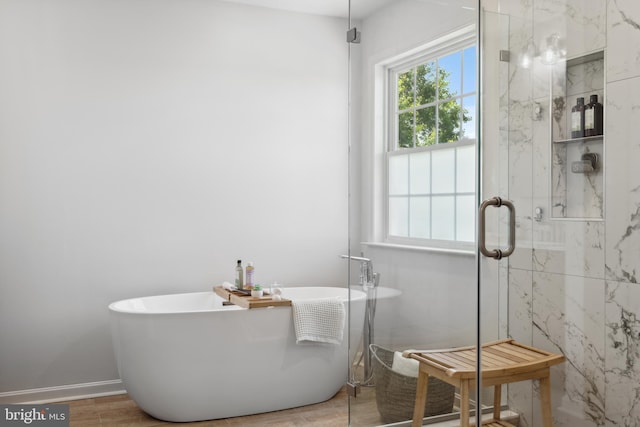 16 Zachary Ct, Boonsboro, MD 21713 - bathroom featuring a soaking tub, a marble finish shower, wood finished floors, and baseboards
