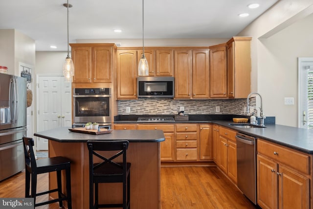 16 Zachary Ct, Boonsboro, MD 21713 - kitchen with appliances with stainless steel finishes, a sink, dark countertops, wood finished floors, and recessed lighting