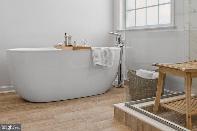16 Zachary Ct, Boonsboro, MD 21713 - full bath with a freestanding tub and wood finished floors