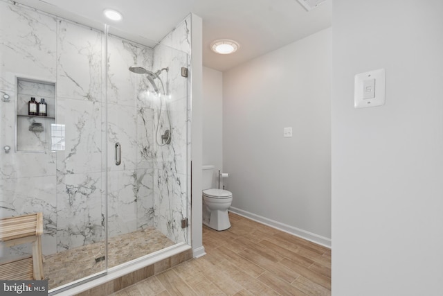 16 Zachary Ct, Boonsboro, MD 21713 - full bathroom featuring toilet, a marble finish shower, baseboards, and wood finished floors