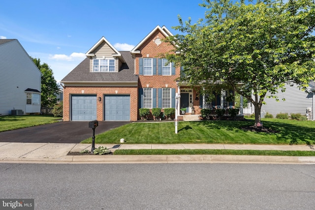 16 Zachary Ct, Boonsboro, MD 21713 - view of front of house with brick siding, driveway, and a front lawn