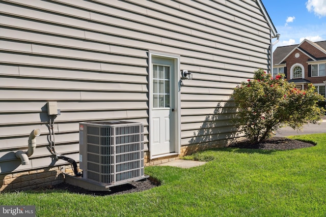 16 Zachary Ct, Boonsboro, MD 21713 - view of side of home with cooling unit and a yard