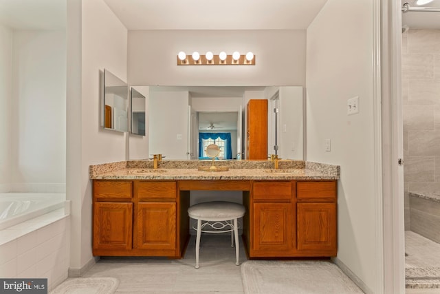 25 Stallion Cir, Upper Holland, PA 19053 - bathroom featuring double vanity, a relaxing tiled tub, tiled shower, and a sink