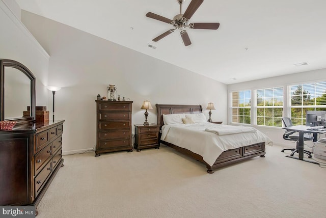 bedroom with light carpet, vaulted ceiling, and visible vents