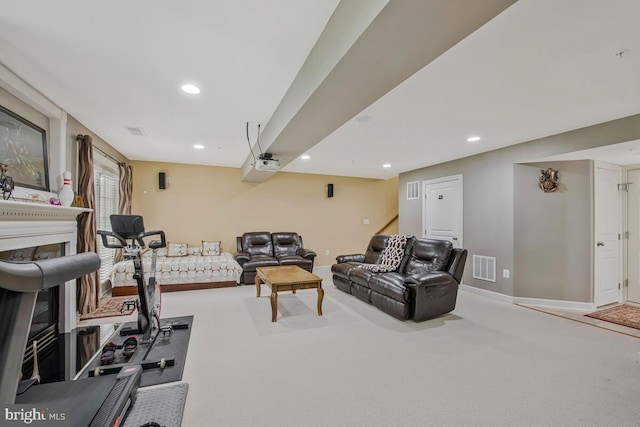 exercise area featuring visible vents, a fireplace, baseboards, recessed lighting, and carpet flooring